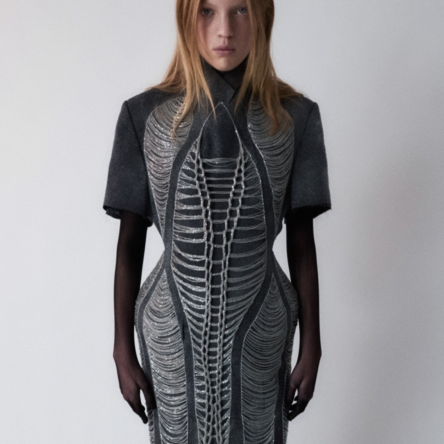 glittery gray long dress with chains details on light gray background 